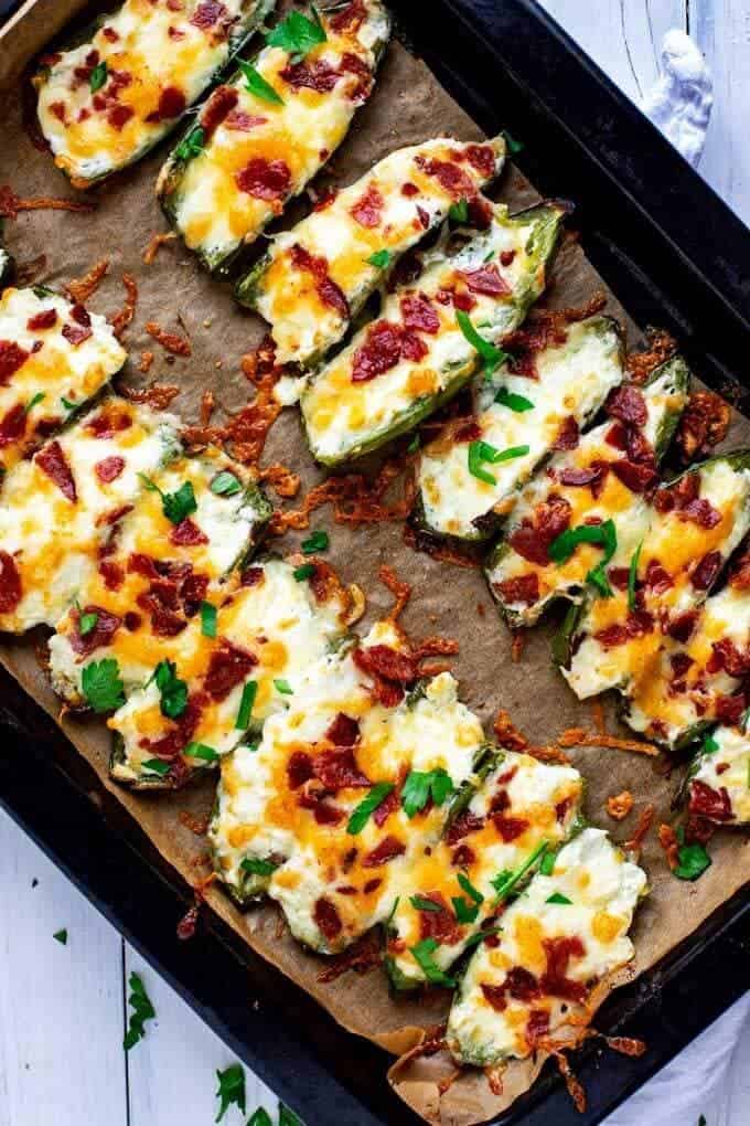 Photo of a baking dish with cooked jalapeno poppers.