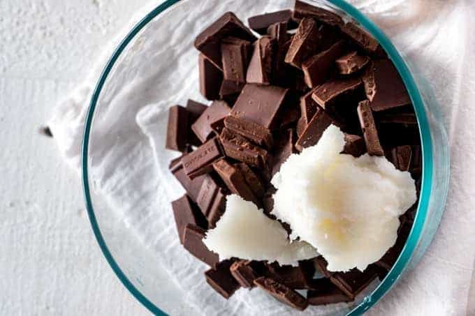 Photo of chocolate and coconut oil in a small glass bowl.
