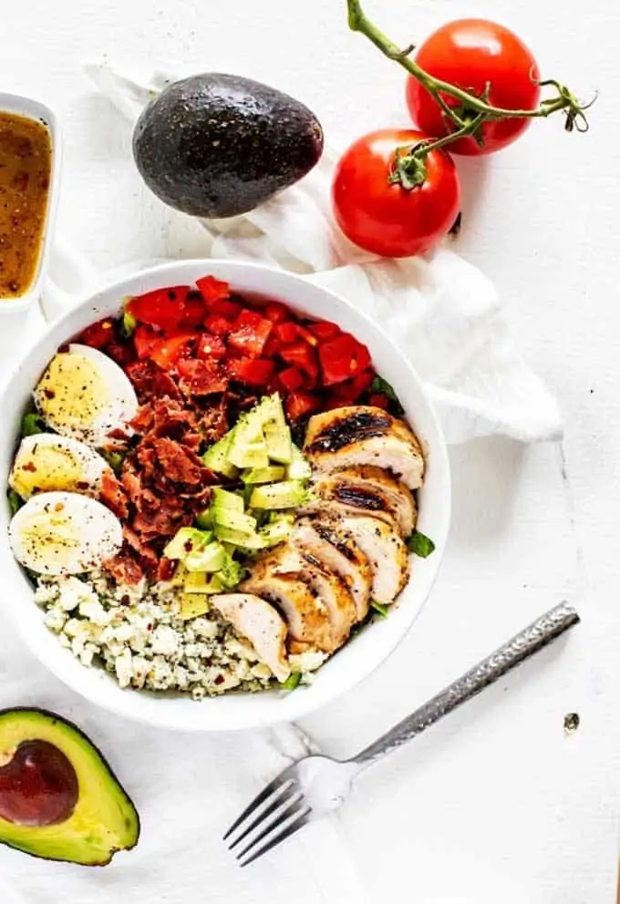 Overhead photo of a keto cobb salad in a white bowl.