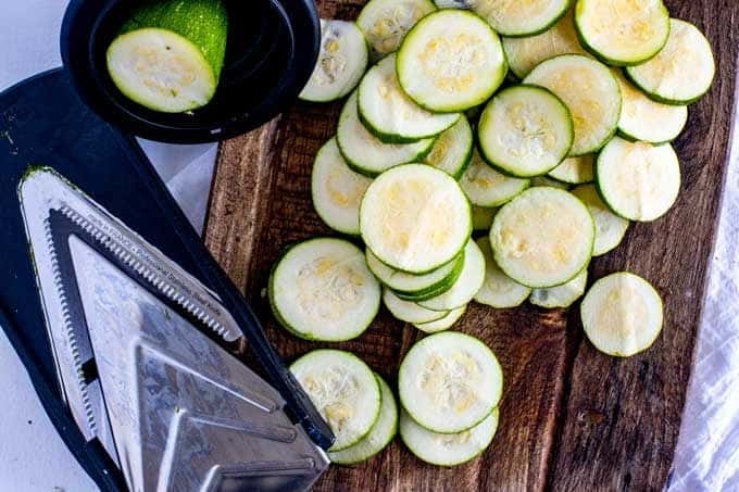 Photo of zucchini being sliced.
