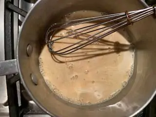 Photo of brown sugar substitute, heavy cream, and sea salt in a saucepan.