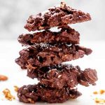 Square photo of 5 Keto Chocolate Haystacks stacked on top of each other.