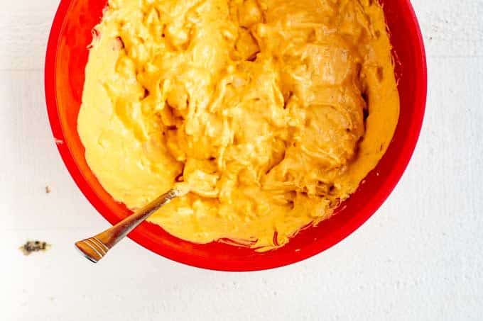 Photo of shredded chicken that has been combined with cream cheese, mayonnaise, ranch dressing, and buffalo sauce.