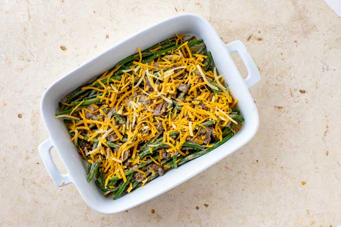 Green bean casserole covered with cheese