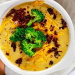 Close up overhead photo of a bowl of keto broccoli cheese soup.