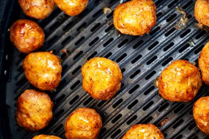 Keto Turkey Meatballs cooking in the air fryer.