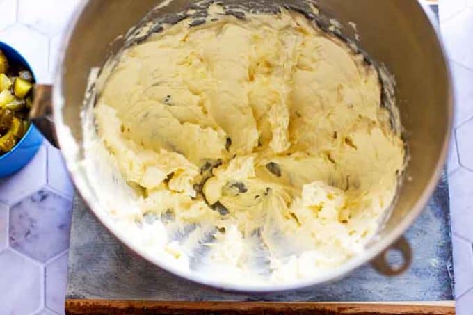 Photo of cream cheese and mayonaise in the bowl of a stand mixer.