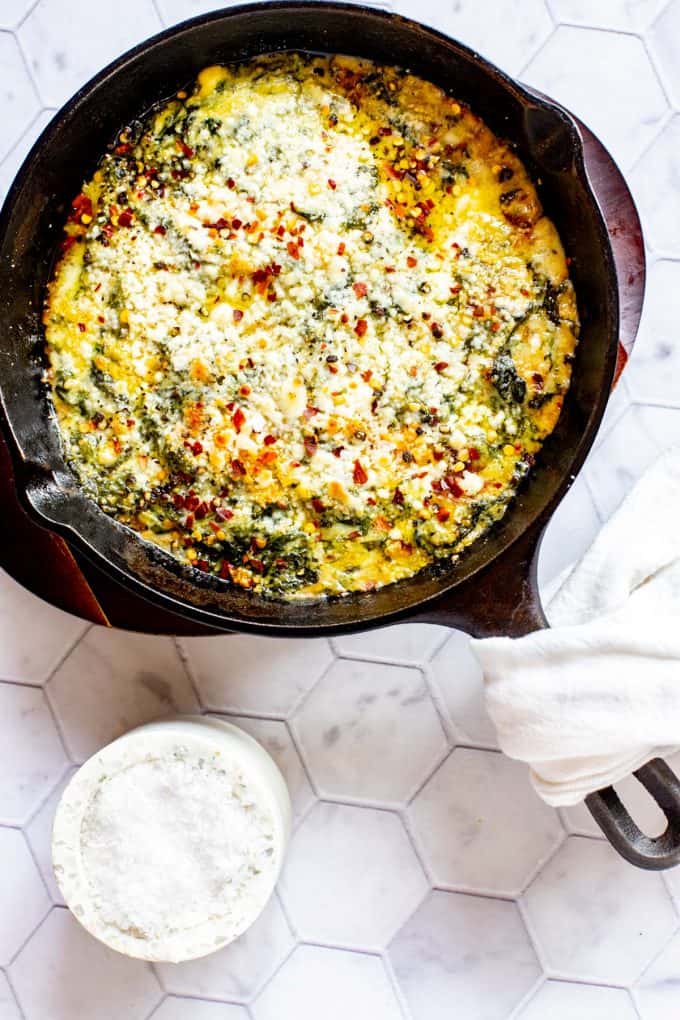 Overhead photo of keto creamed spinach in a cast iron skillet.