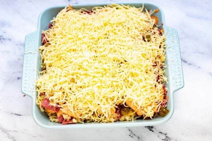 Photo of a casserole dish that is topped with cheese.
