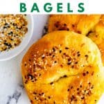 Photo of two bagels on a white surface with the words Keto Fathead Bagels above it.
