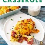 Photo of a cheesy casserole on a white plate with the text Reuben Casserole above it.