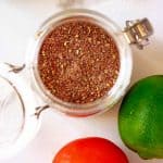 Square Close up photo of Keto Taco Seasoning in a jar on a white background.