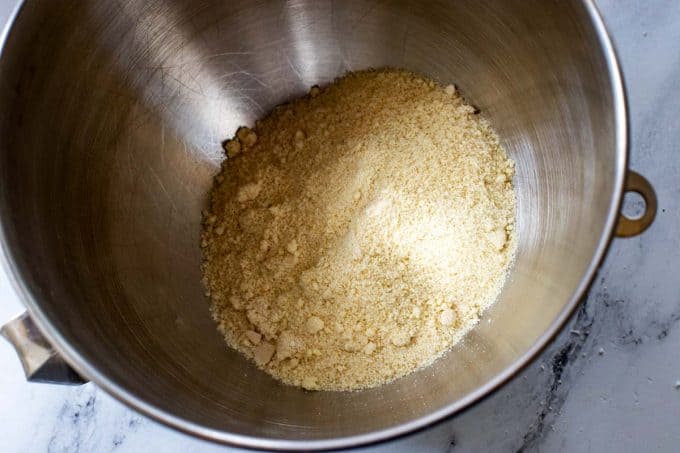 Almond flour and oat fiber in the bowl of a stand mixer.