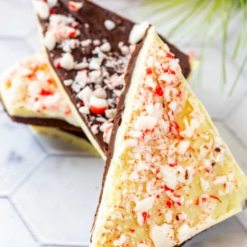 Close up square photo of white and dark Keto Peppermint Bark on a white background.