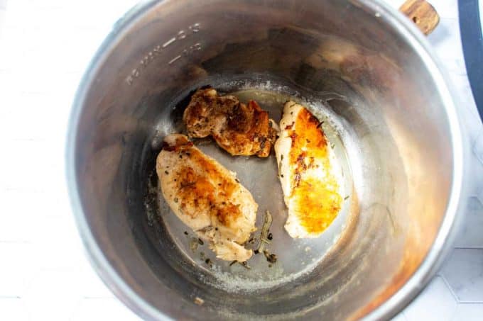 Photo of chicken sautéing in an instant pot.