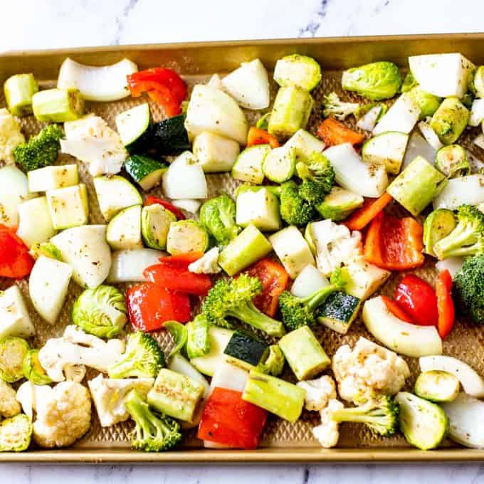 Baking cheese with a medley of chopped vegetables.