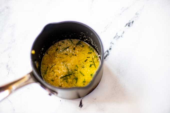 Photo of parmesan garlic butter in a small saucepan.