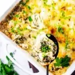 Square photo of a keto mushroom casserole with a cheesy bite being pulled from it.
