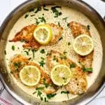 Square overhead photo of a saute pan with keto lemon chicken in it.