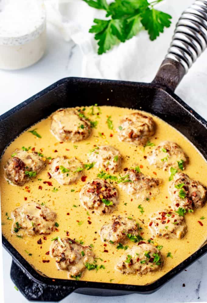 Photo of a skillet with low carb Swedish meatballs.