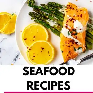 Overhead photo of salmon on a bed of asparagus and the text that says Keto Seafood Recipes.