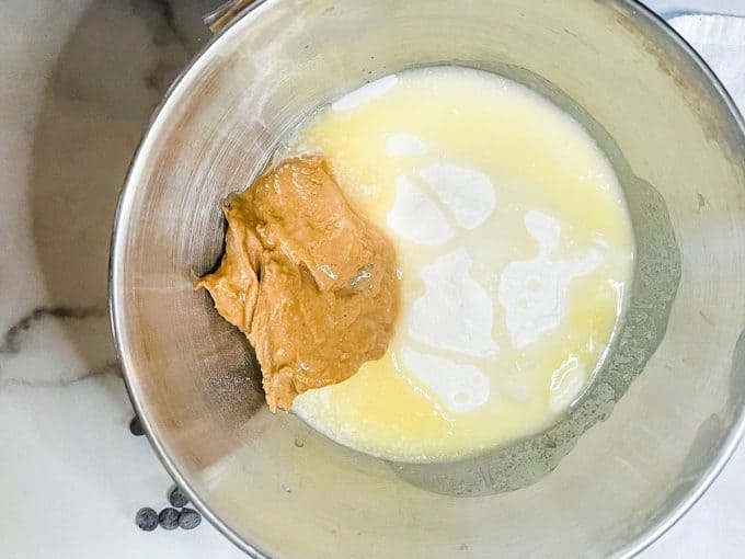 Photo of a bowl of keto sweetener, peanut butter, and melted butter.