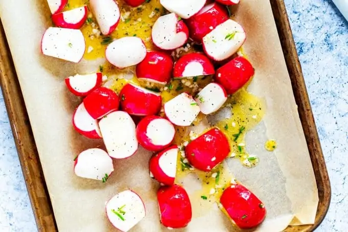 Photo of a sheetpan with radishes ready to go in the oven.