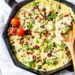 Square close up photo of keto chicken carbonara in a cast iron skillet.