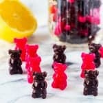 Square side photo of keto gummy bears with a mason jar full of gummy bears behind it.