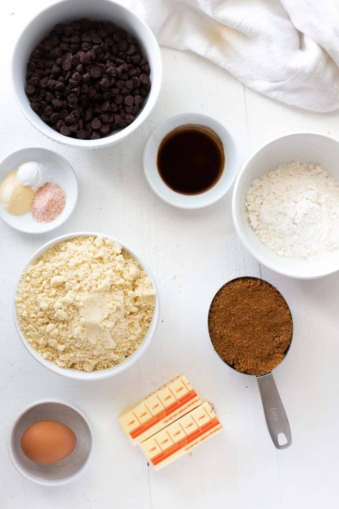 Prep bowls with chocolate chips, vanilla, sweeteners, almond flour, butter, and egg, salt, baking powder, and xanthan gum.