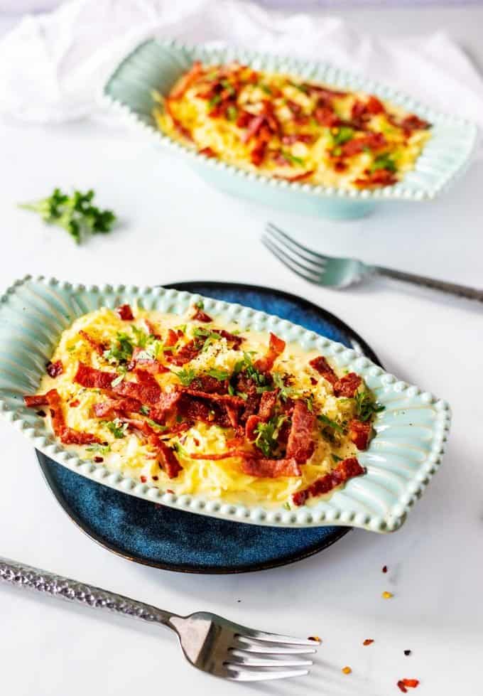 Side photo of two dishes of spaghetti squash carbonara.