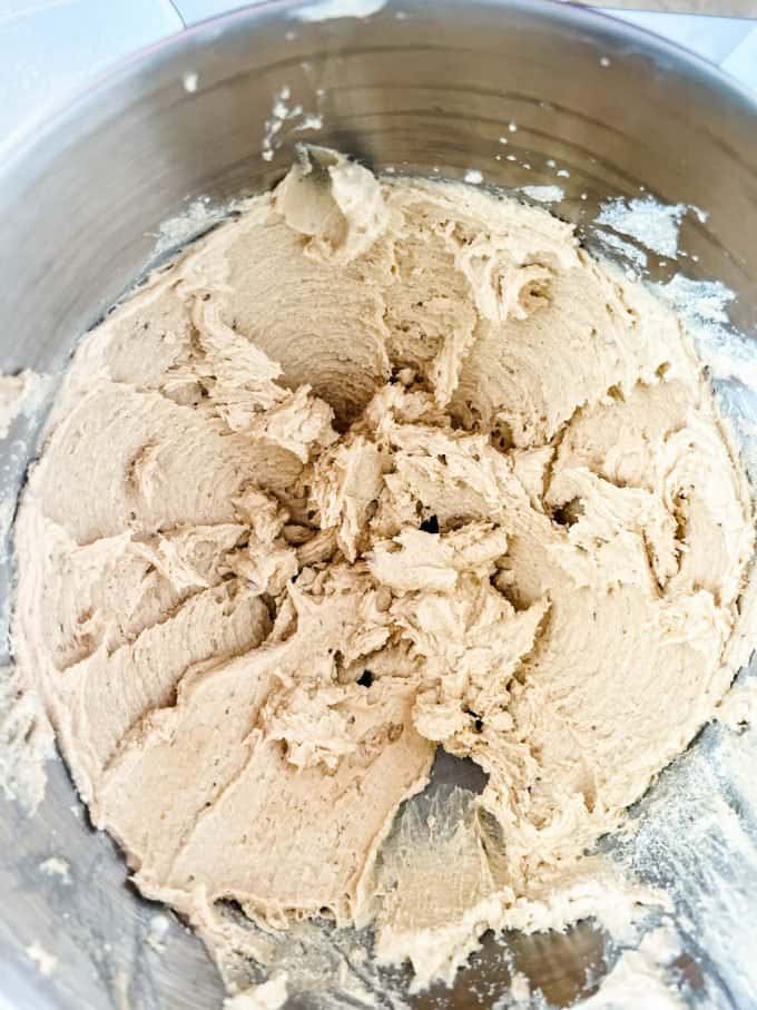 Photo of keto cookie dough without chocolate chips in a bowl of a stand mixer.