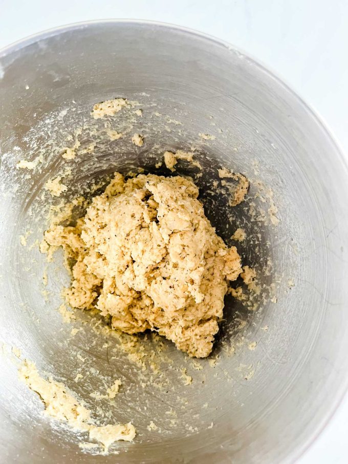 Fathead dough that has been mixed together in the bowl of a stand mixer.