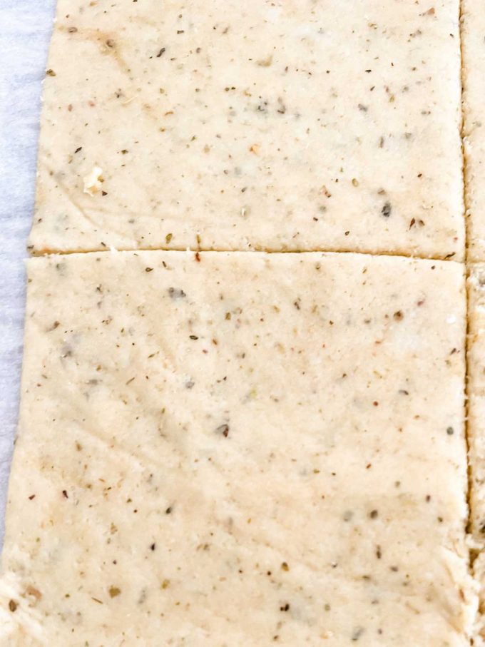 Fathead dough that has been cut into a square.