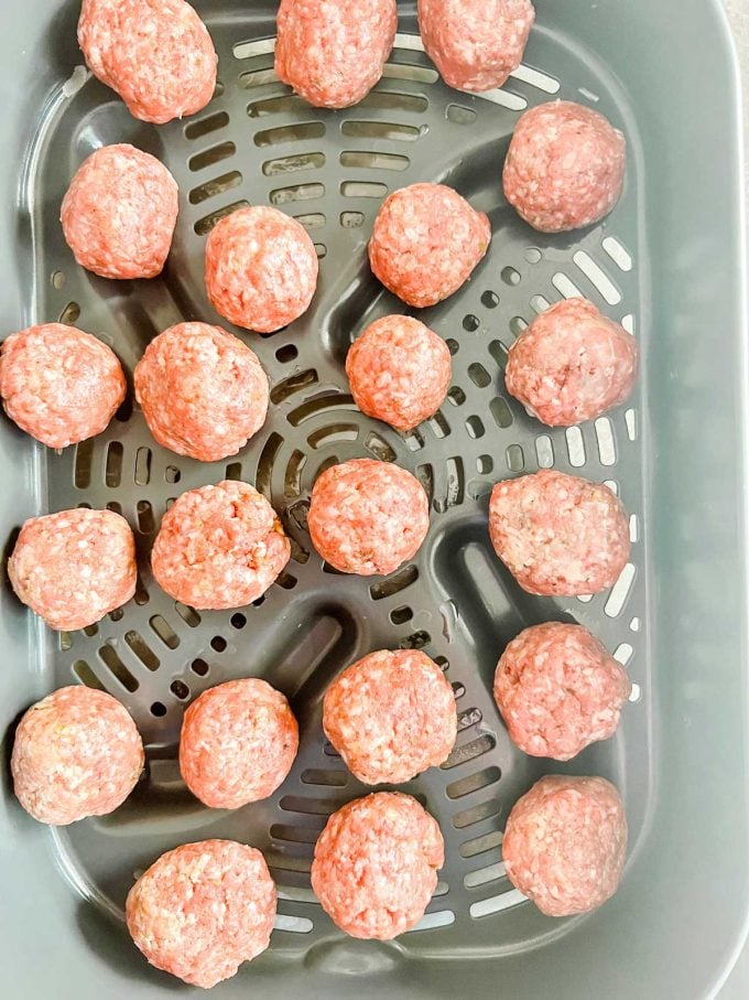 Photo of meatballs in an air crisp air fryer basket.