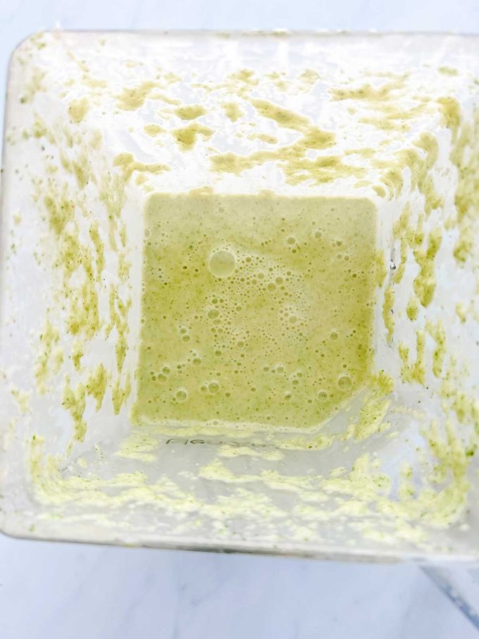 Photo of half of a broccoli soup recipe that has been pureed in a blender.