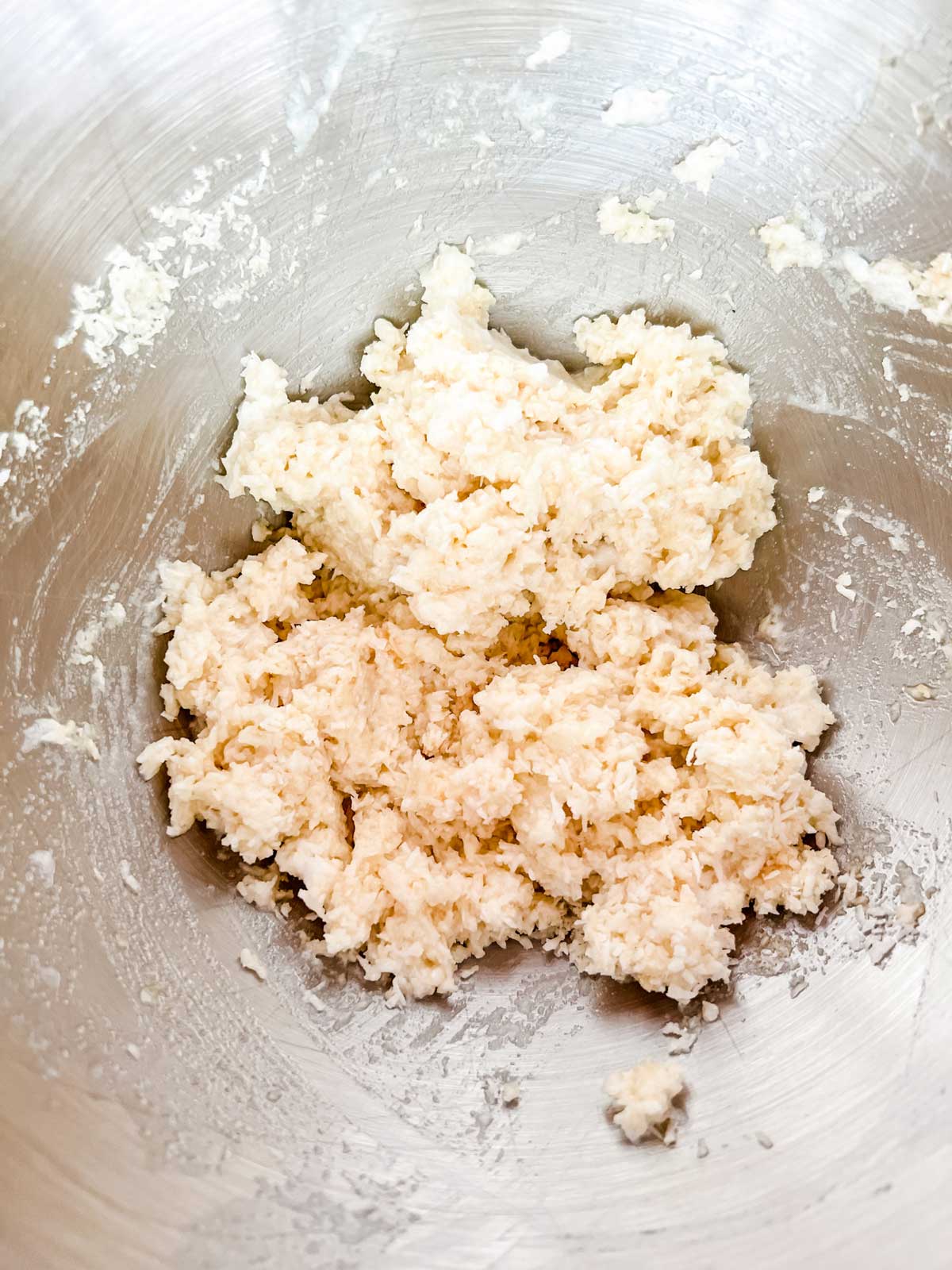 Photo of keto macaroon dough in the bowl of a stand mixer.