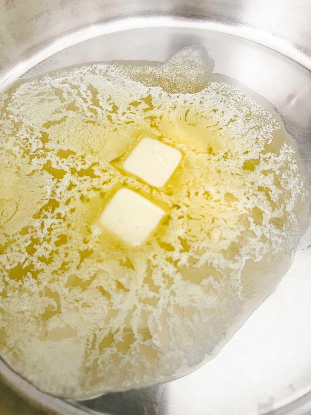 Photo of butter melting in a skillet.