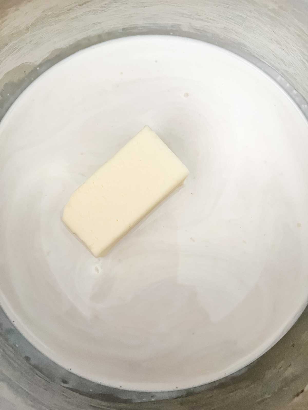 Photo of cream and butter in a saucepan.
