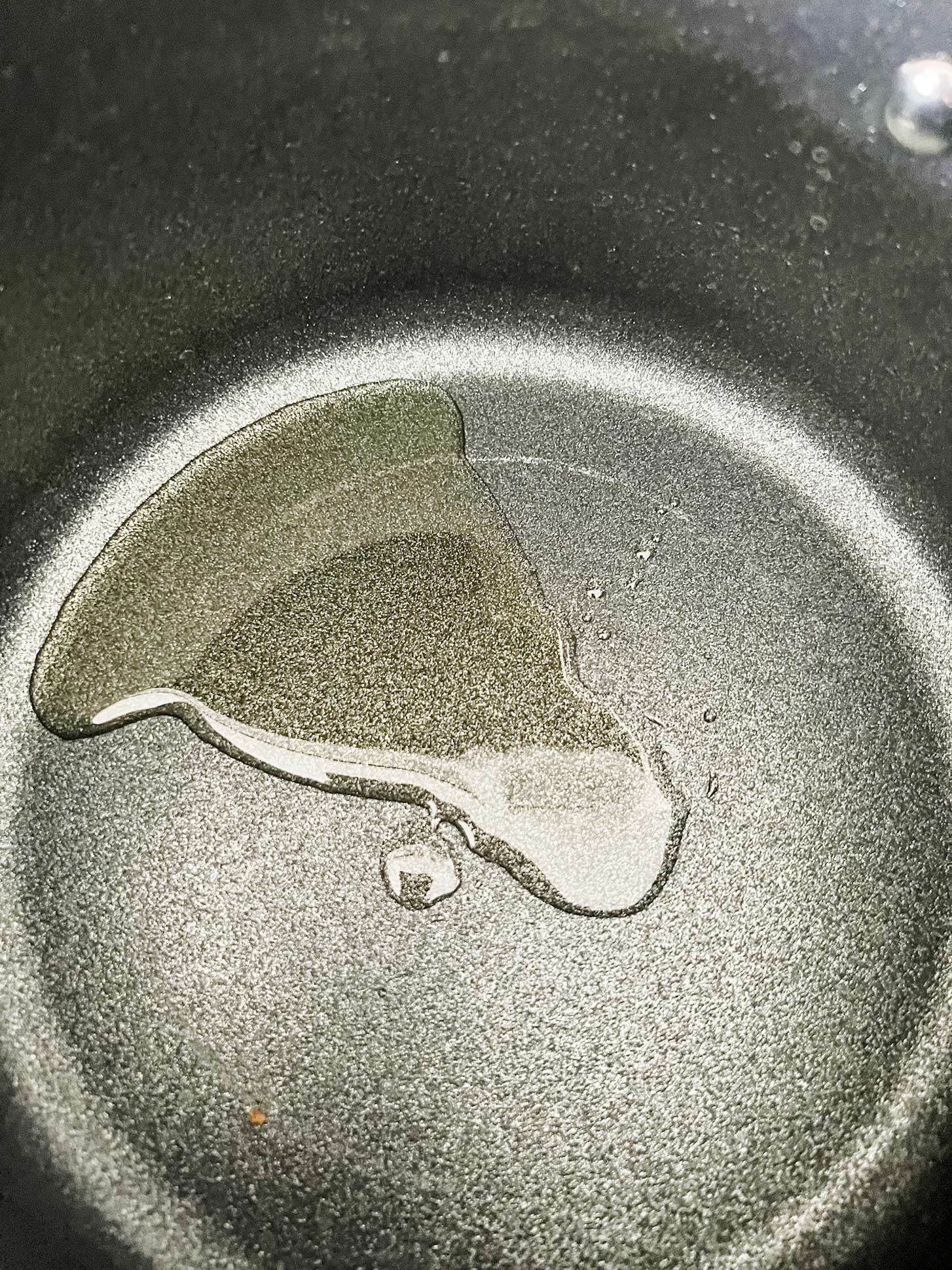 Oil heating in a saucepan.