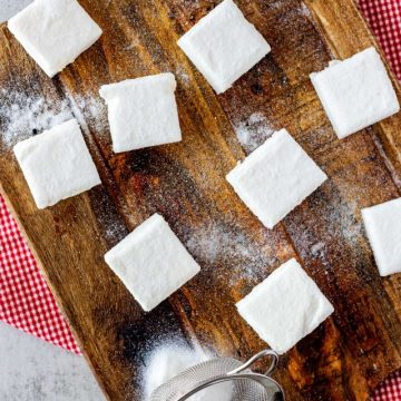 Overhead photo of a wooden cutting board with keto marshmallows.