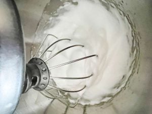 Egg whites that have been beaten in a stand mixer.