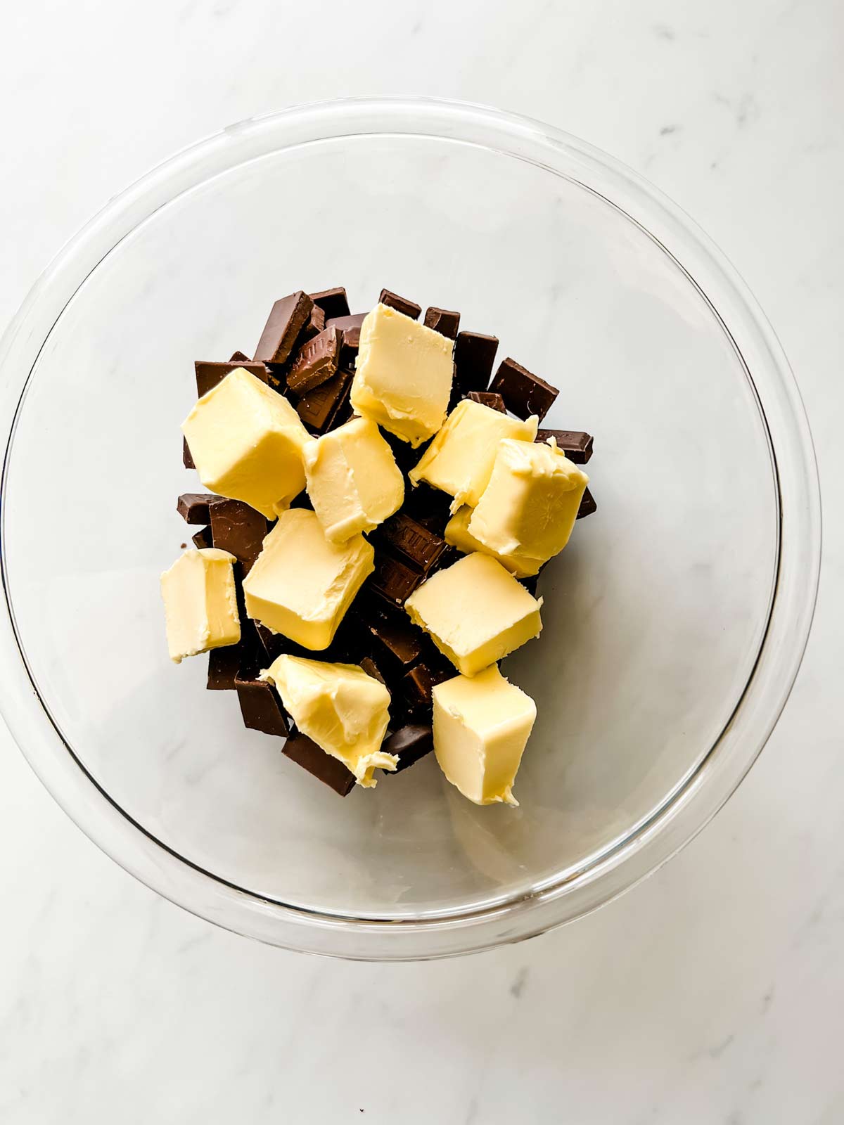 Photo of chocolate and butter in a glass bowl.