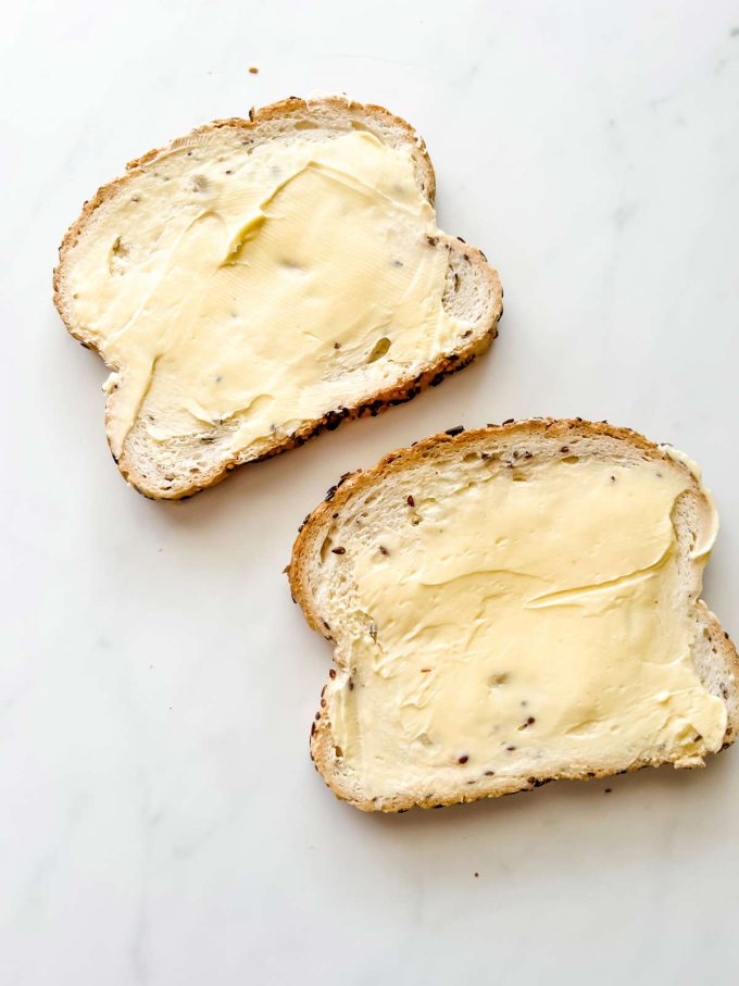 Two sliced of buttered bread.