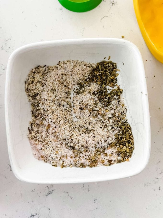 Lemon pepper seasoning and sale in a small dish.