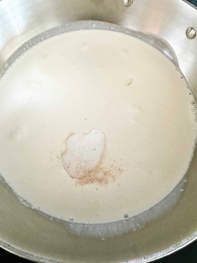 Ice cream base with xanthan gum added in a saucepan.